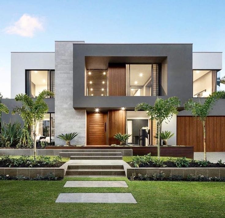 Modern luxury house with a landscaped front yard.